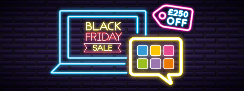 Neon signs against a black wall - show a neon outline of a laptop, with the words 'Black Friday Sale' on the screen.  plus a speech bubble with colourful squares to represent the GuideConnect logo and a price tag that says £250 off
